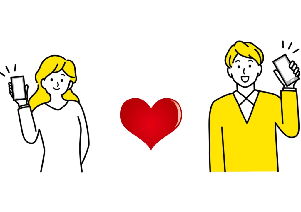 スマートフォンをもって間にハートマークがある男女